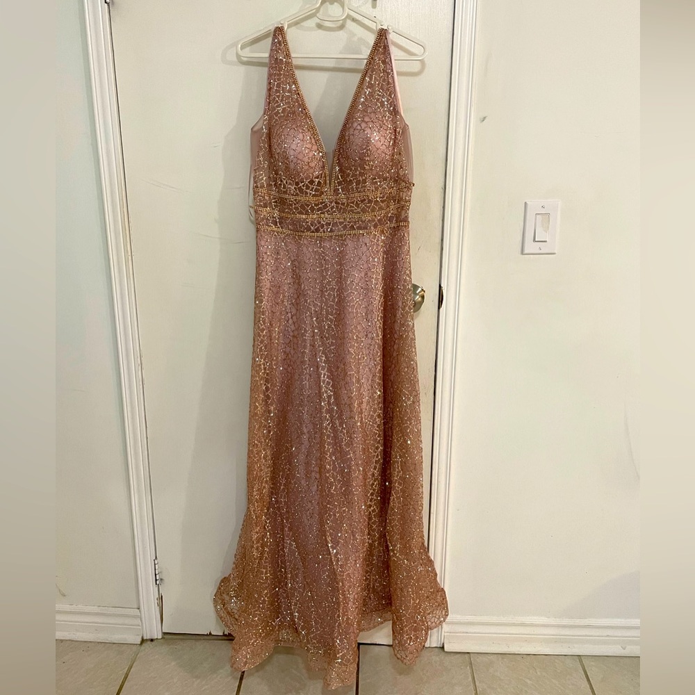 Sparkly pink dress with a mesh covered neckline.
